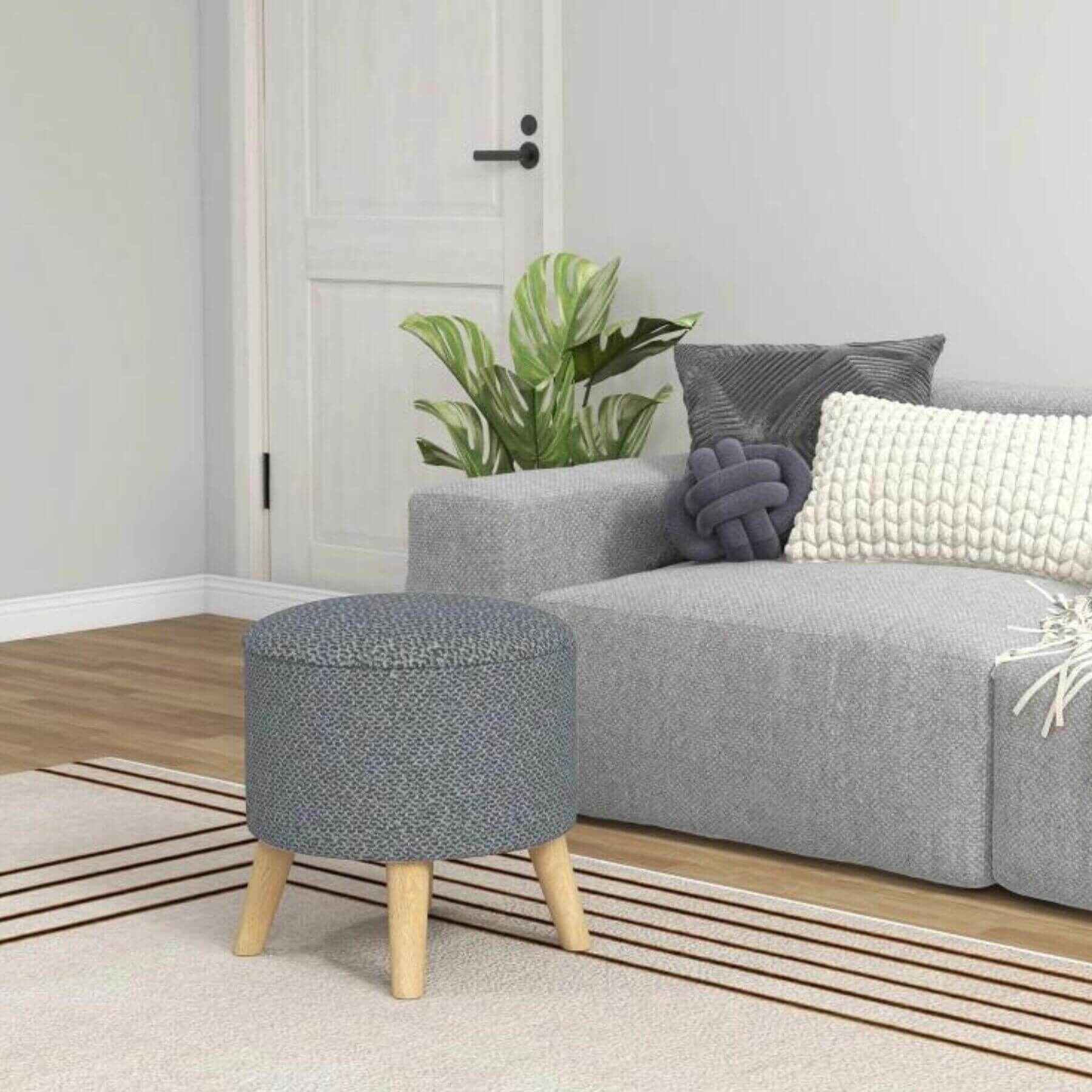 HOMCOM Round Ottoman Stool with Storage and Wood Legs Gray in front of Couch