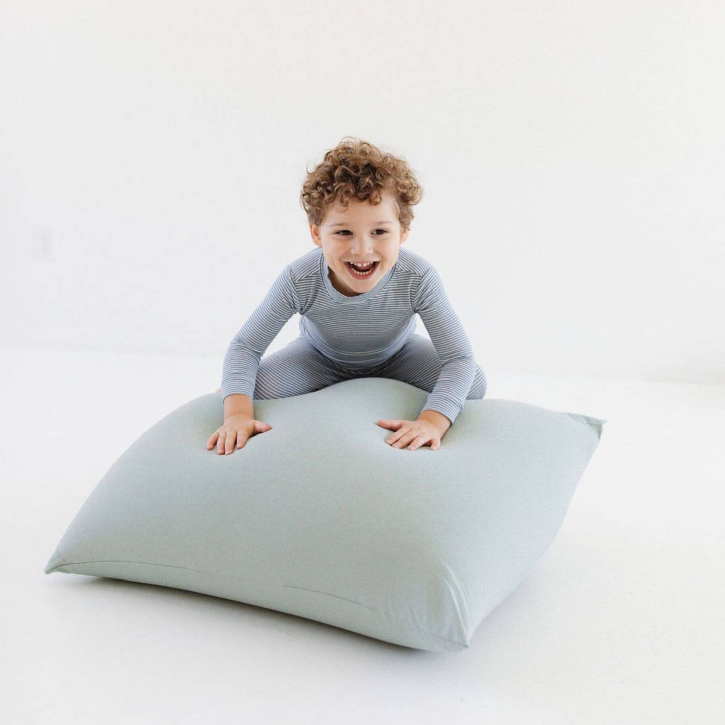 Child playing on Toki Kids Sage Bean Bag