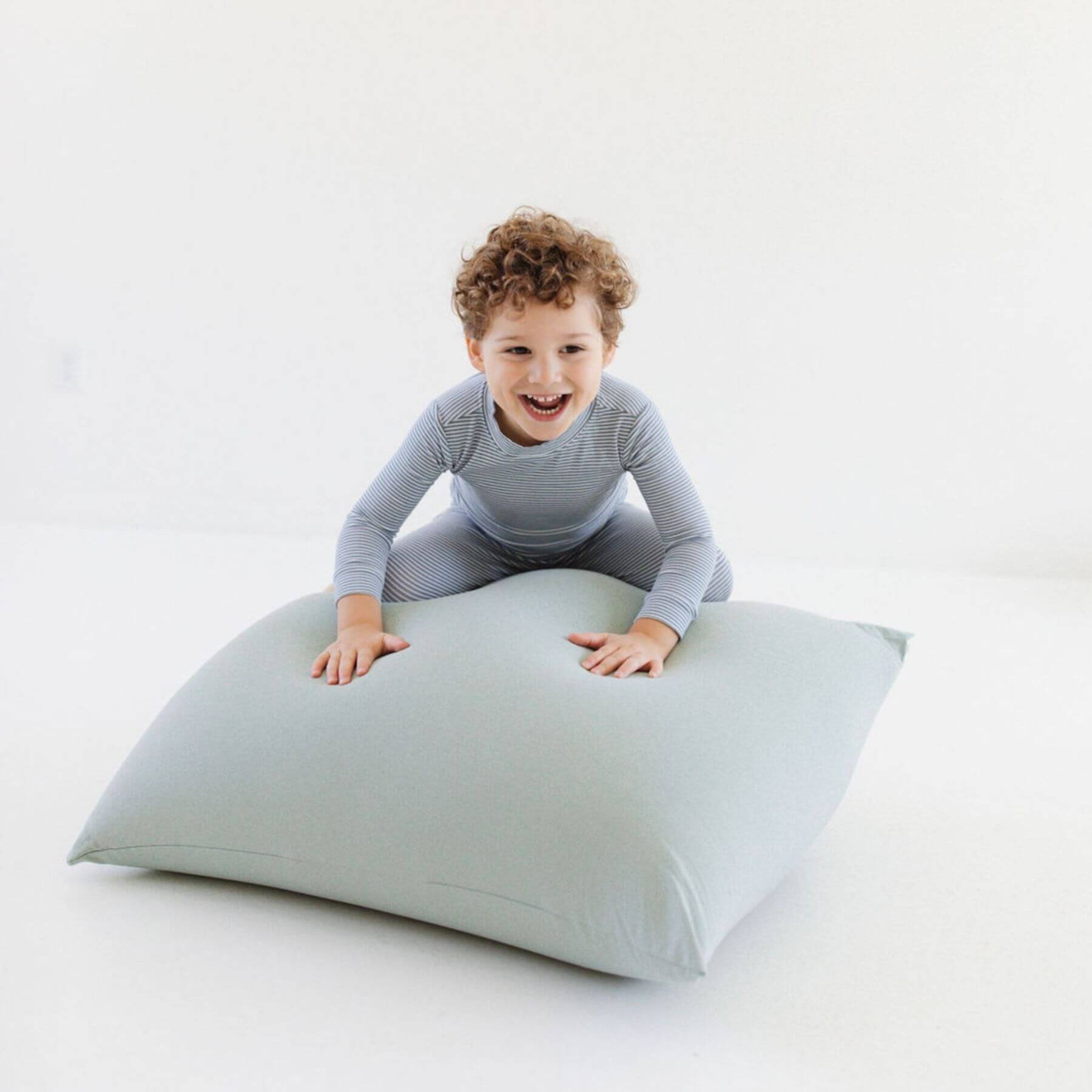 Child playing on Toki Kids Sage Bean Bag