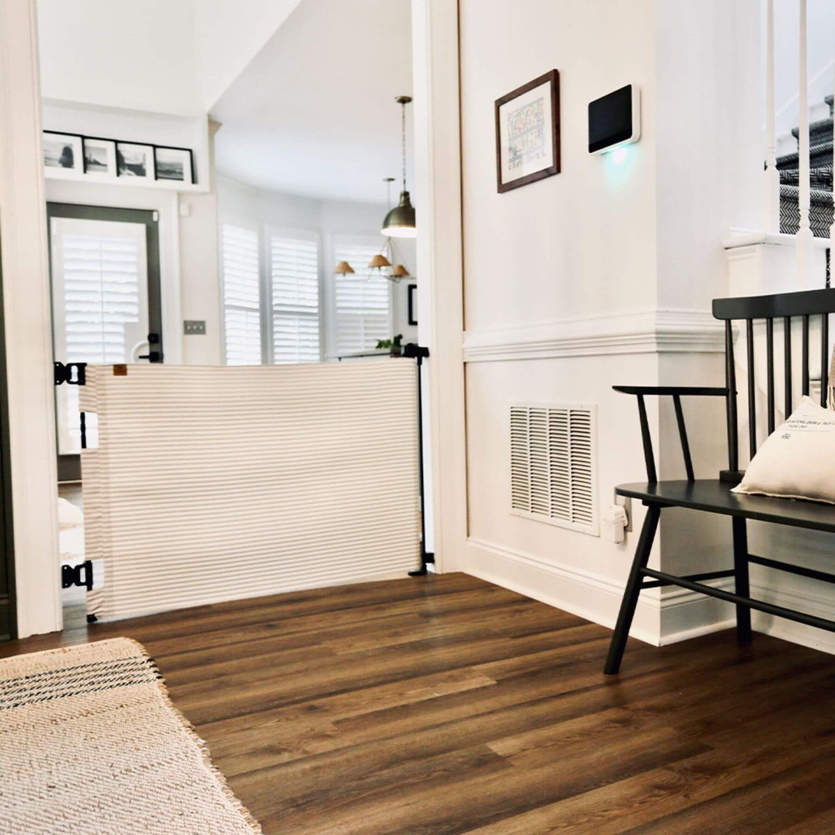 A baby gate in a living room