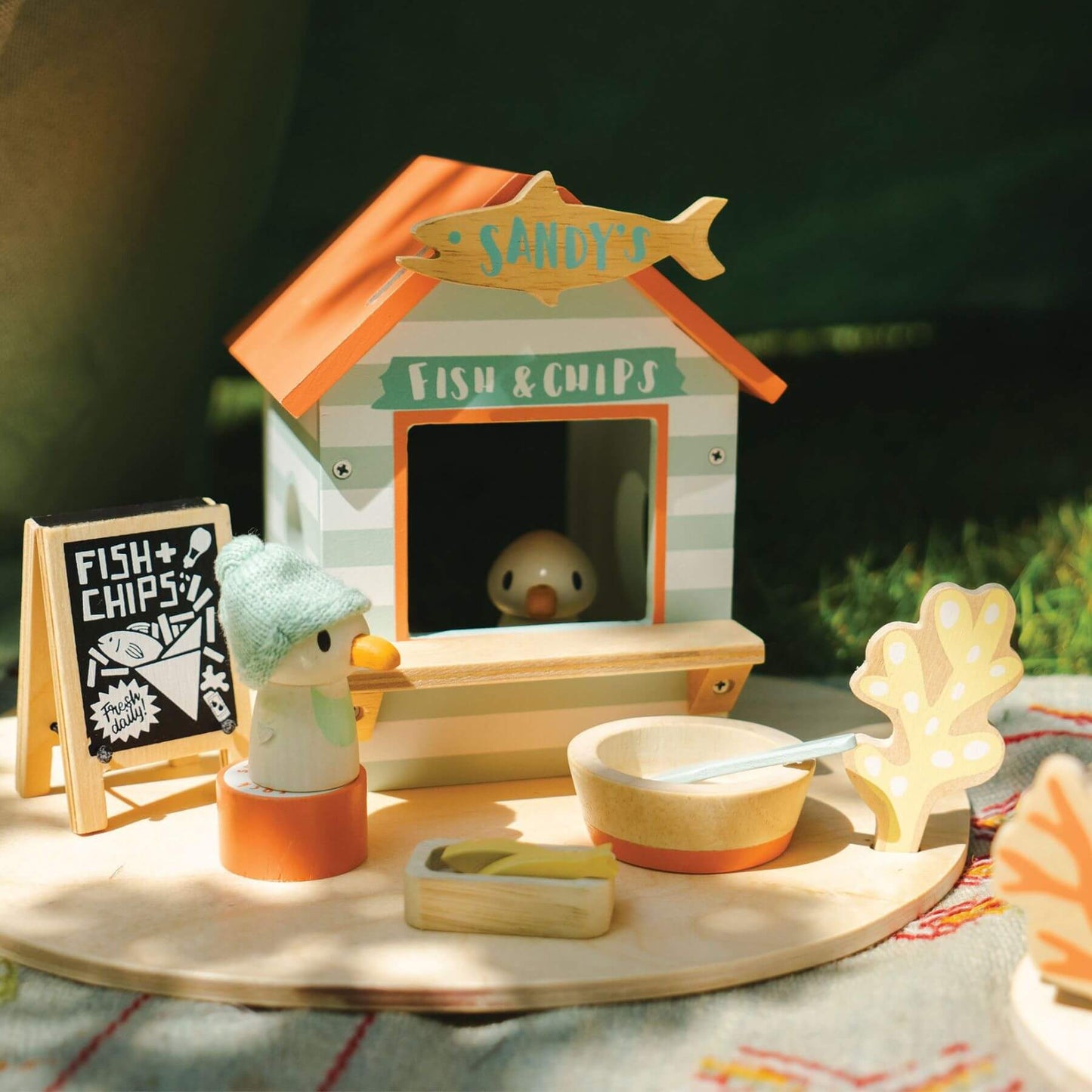 Tender Leaf Sandy's Beach Hut on a table outdoors.