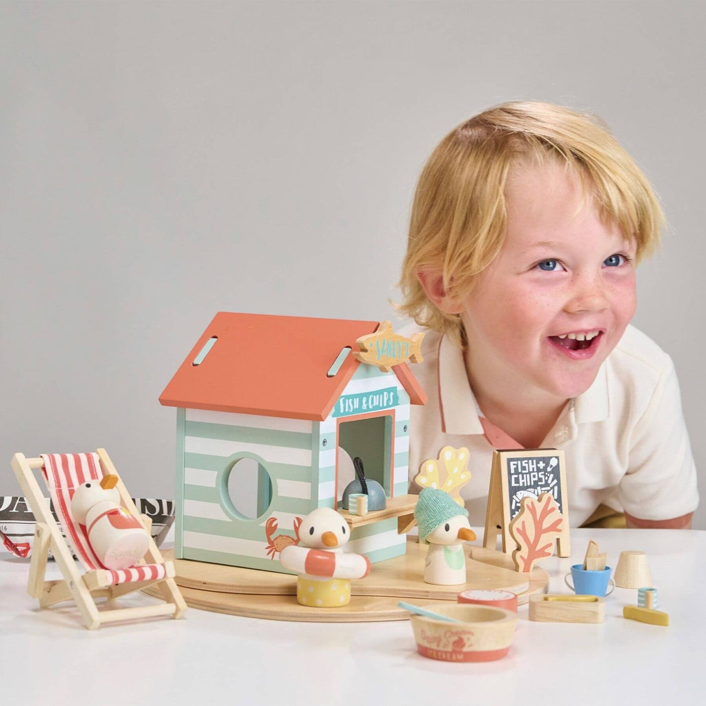 Child playing with Tender Leaf Sandy's Beach Hut