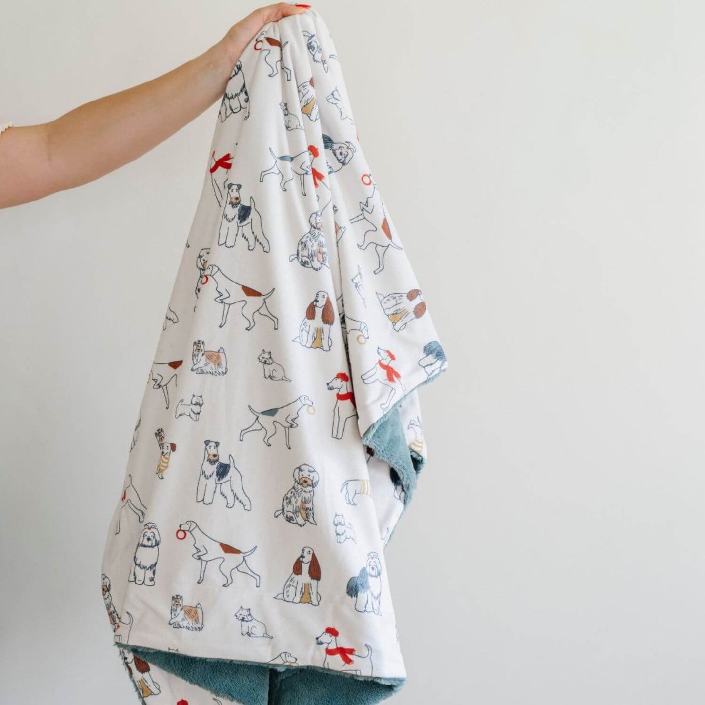 Saranoni Minky/Lush Receiving Blanket Dog held by a hand