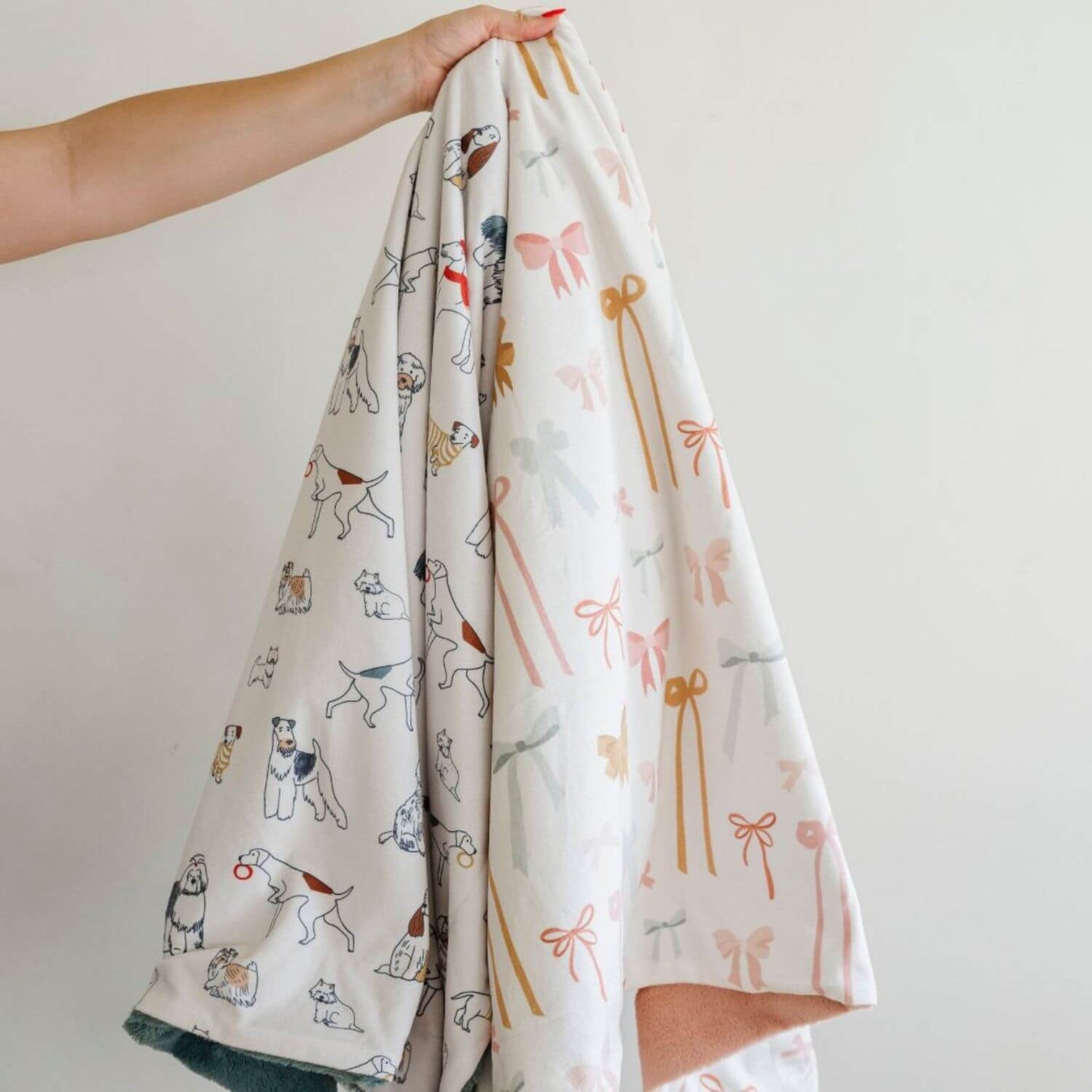 Saranoni Minky/Lush Receiving Blankets held by a hand