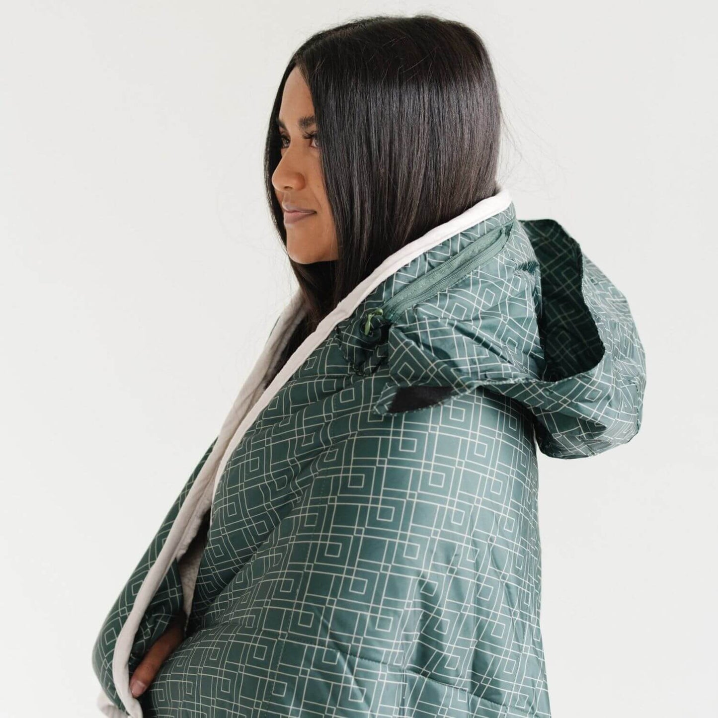 Woman wearing Saranoni Outdoor Blanket on a plain background