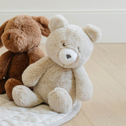 Two Saranoni Stuffed Animals, sitting on a light-colored surface.