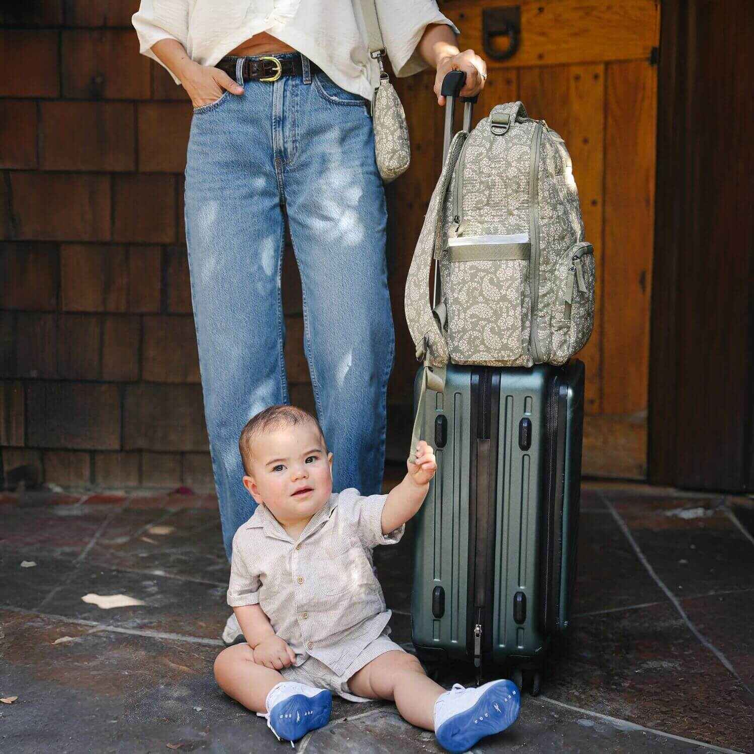 Sazan + JuJuBe Classic Diaper Backpack - Paisley Floral attached to Luggage