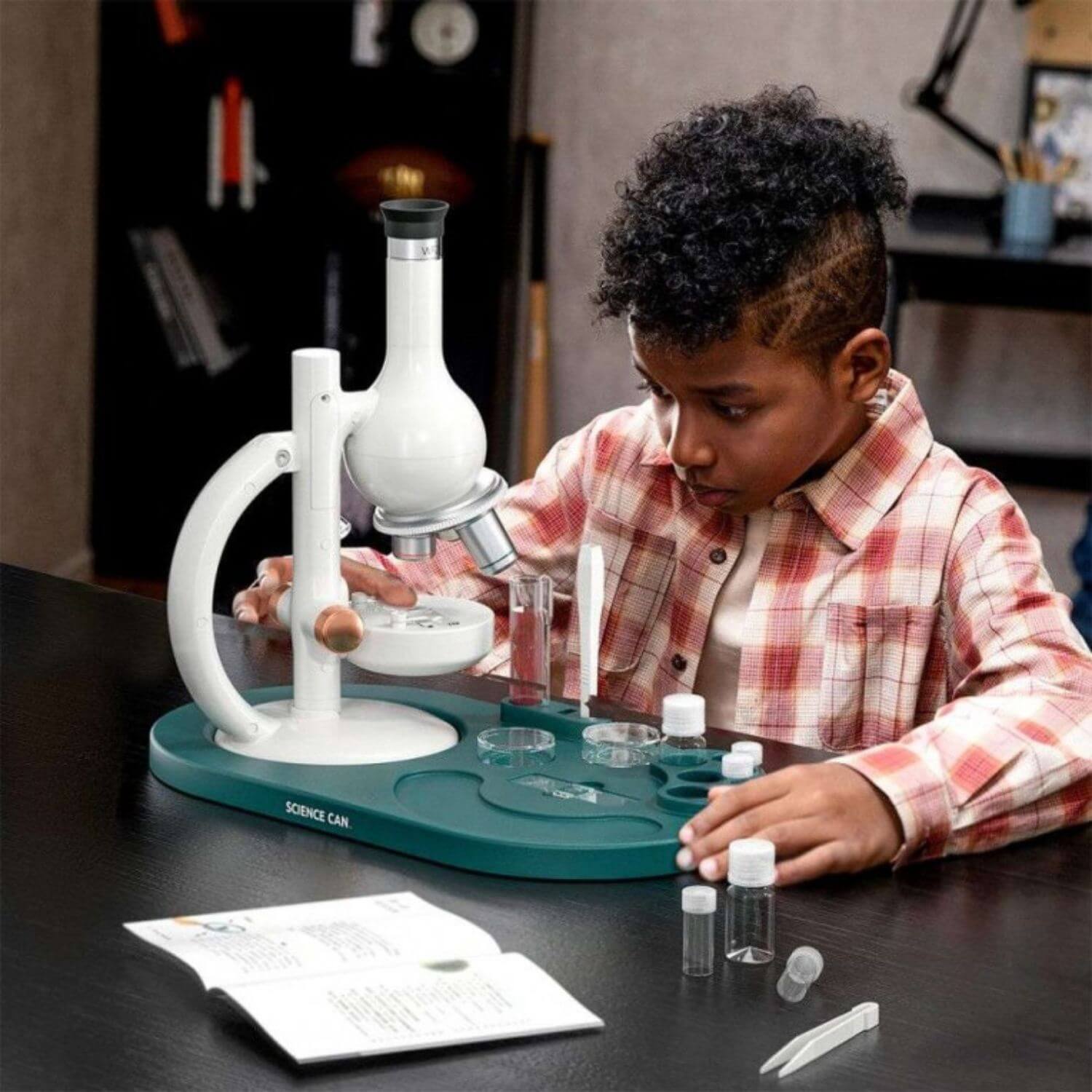 Boy Doing Experiment with Science Can Microscope Lab Edition