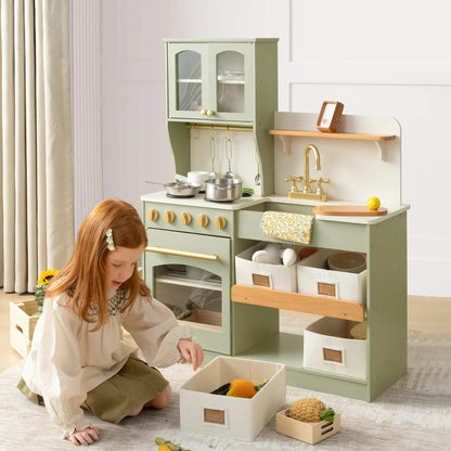 Child playing with Tiny Land® Serenity Play Kitchen Sage Green in a room.