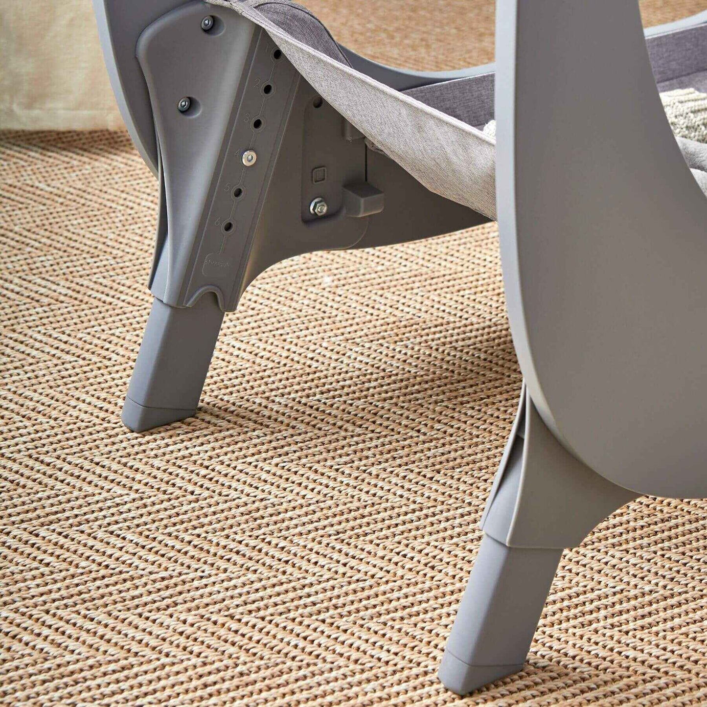 Shnuggle Air Lite Bedside Bassinet - Gray on a textured beige surface