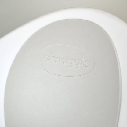 Close-up of Shnuggle Bath & Change Bundle with 'snuggle' branding