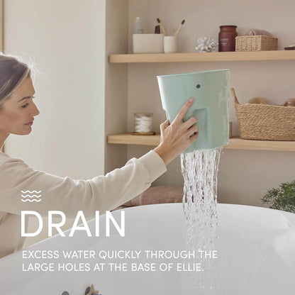 Woman using a tablet with water draining from it, in a home setting.