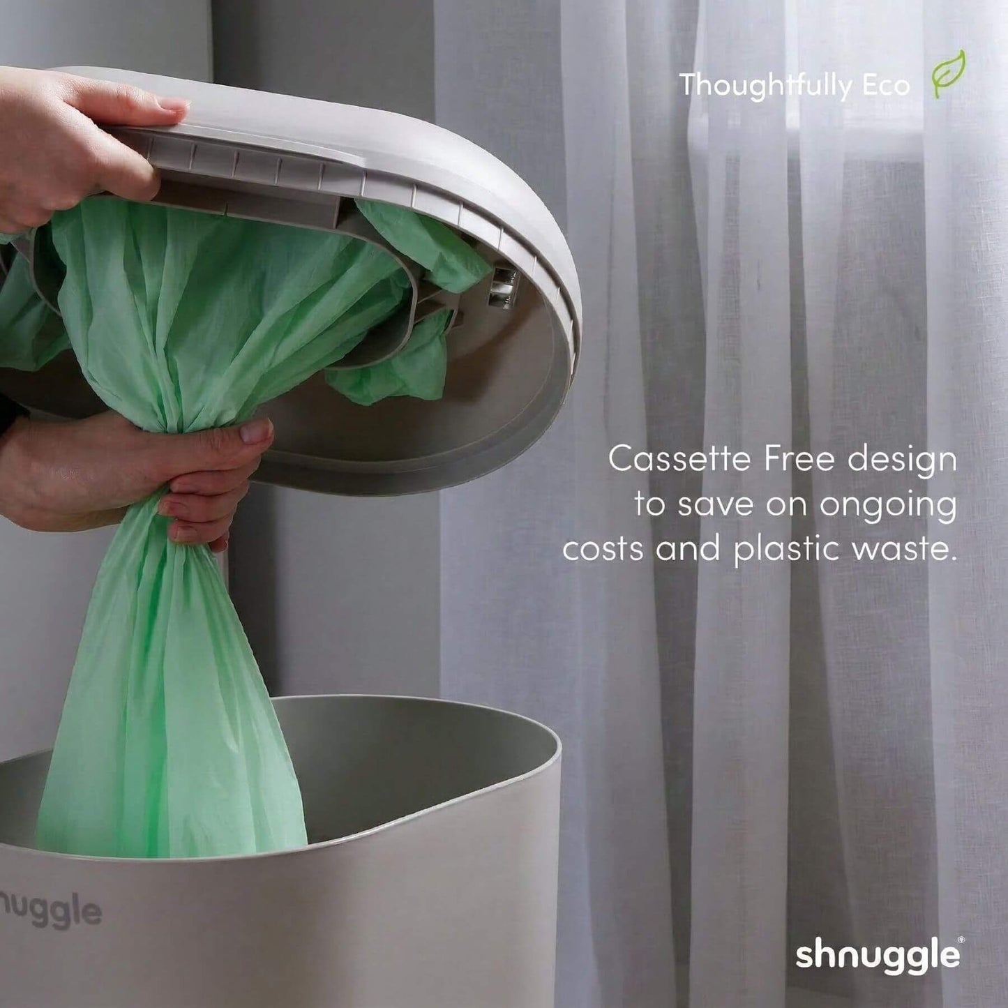 Person using Shnuggle Eco-Touch Nappy Bin Diaper Pail - Taupe, with text highlighting eco-friendly features.