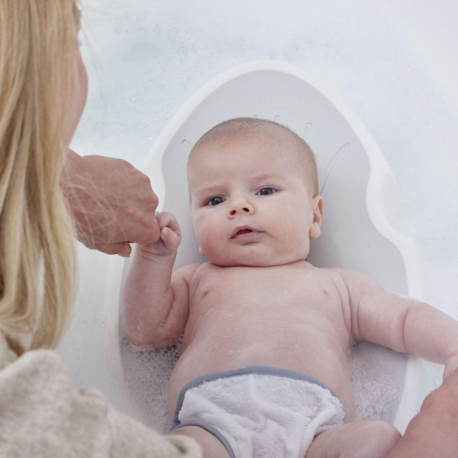 Baby getting washed on Shnuggle Newborn Baby Bath Support