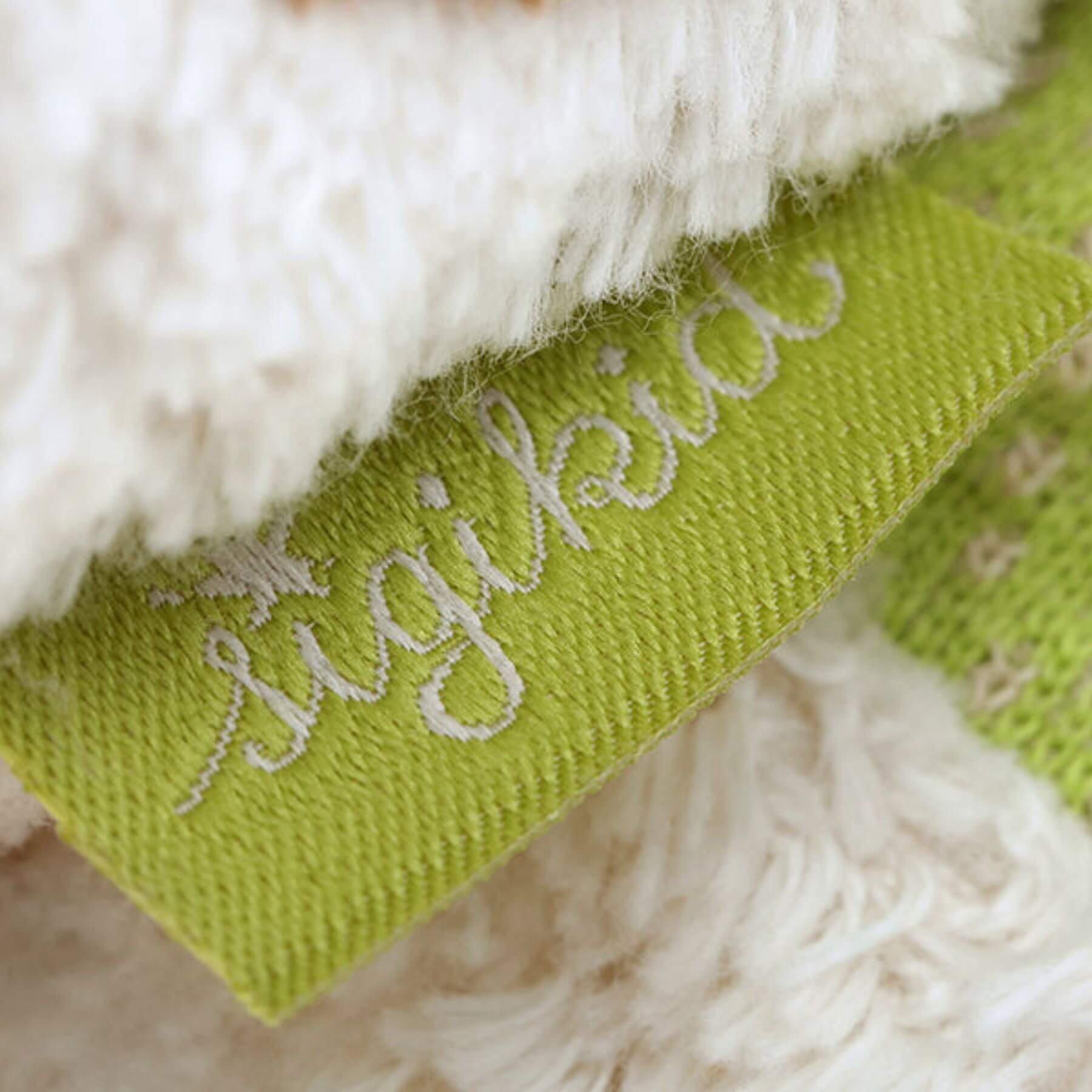 Close-up of a green tag with 'Sugikids' branding