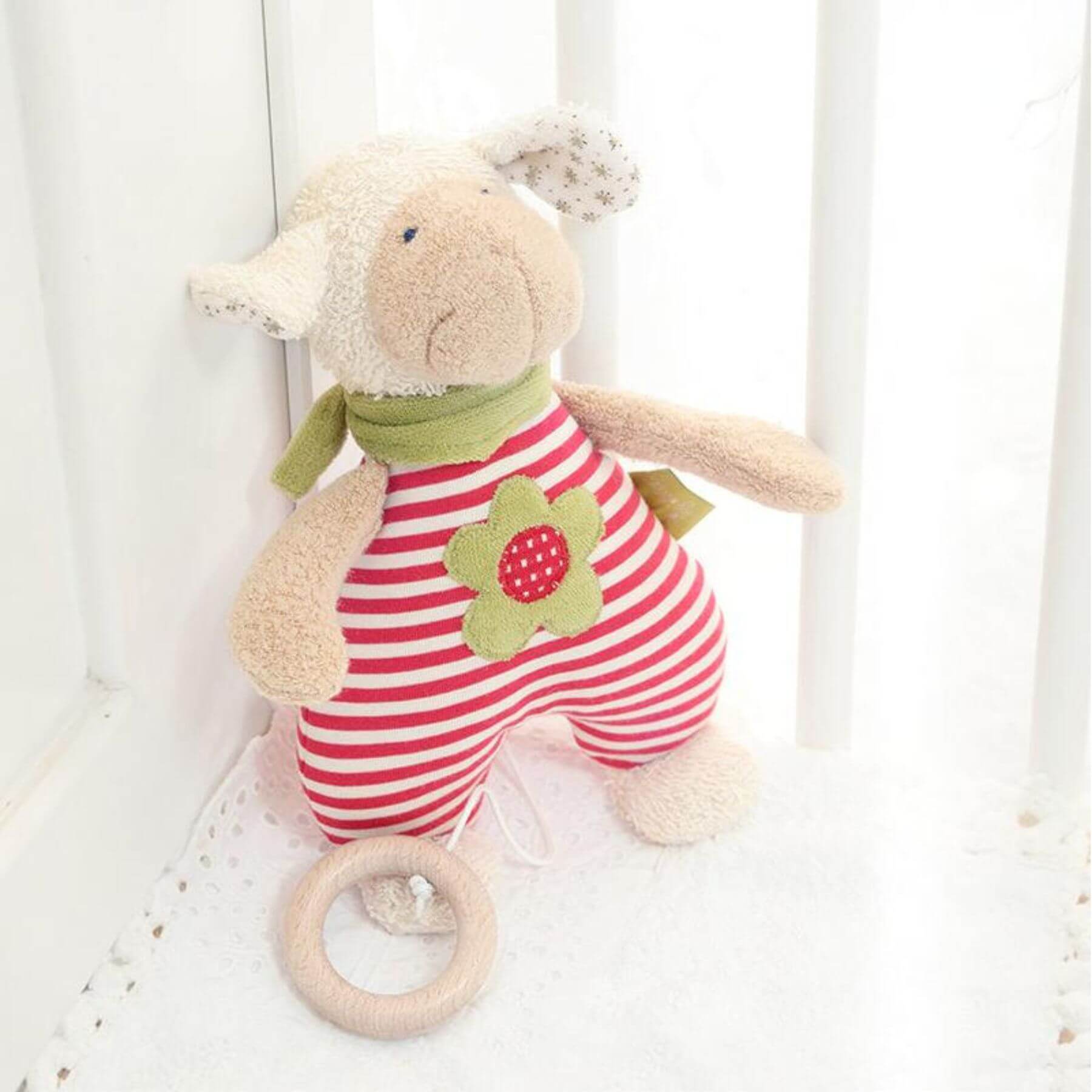 sigikid Organic Sheep Musical Toy in a crib