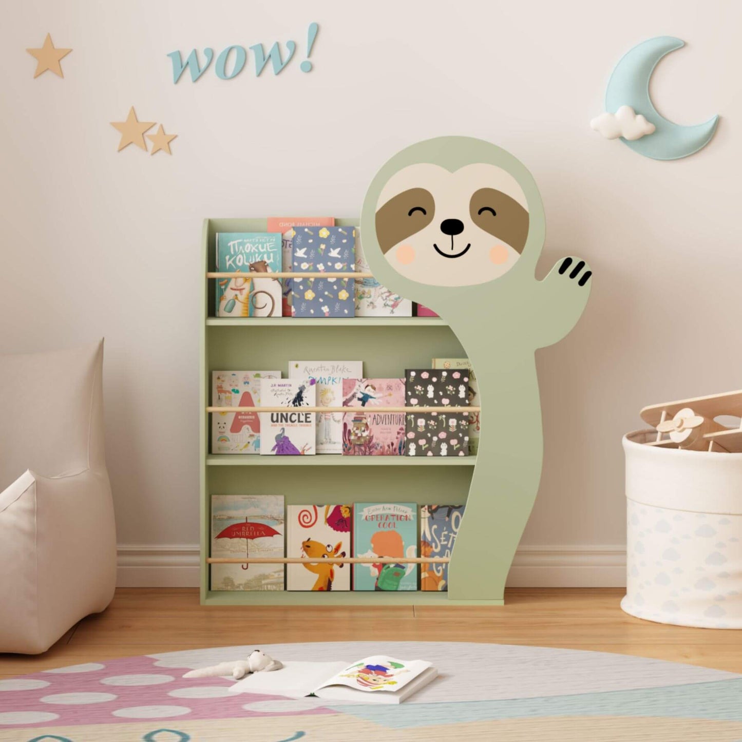 MOONRIVER Sloth Kids 3-Tier Front-Facing Bookshelf - Sage Green with books on a wooden floor.