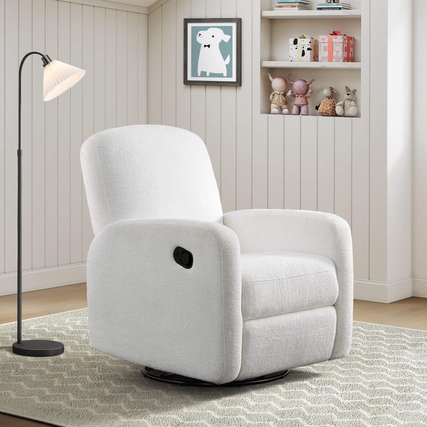 Oxford Baby Snuggly Glider - Plush White in a room with a lamp and shelves.