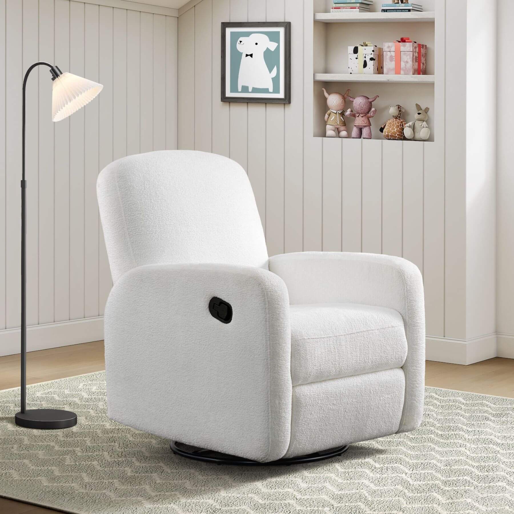 Oxford Baby Snuggly Glider - Plush White in a room with a lamp and shelves.