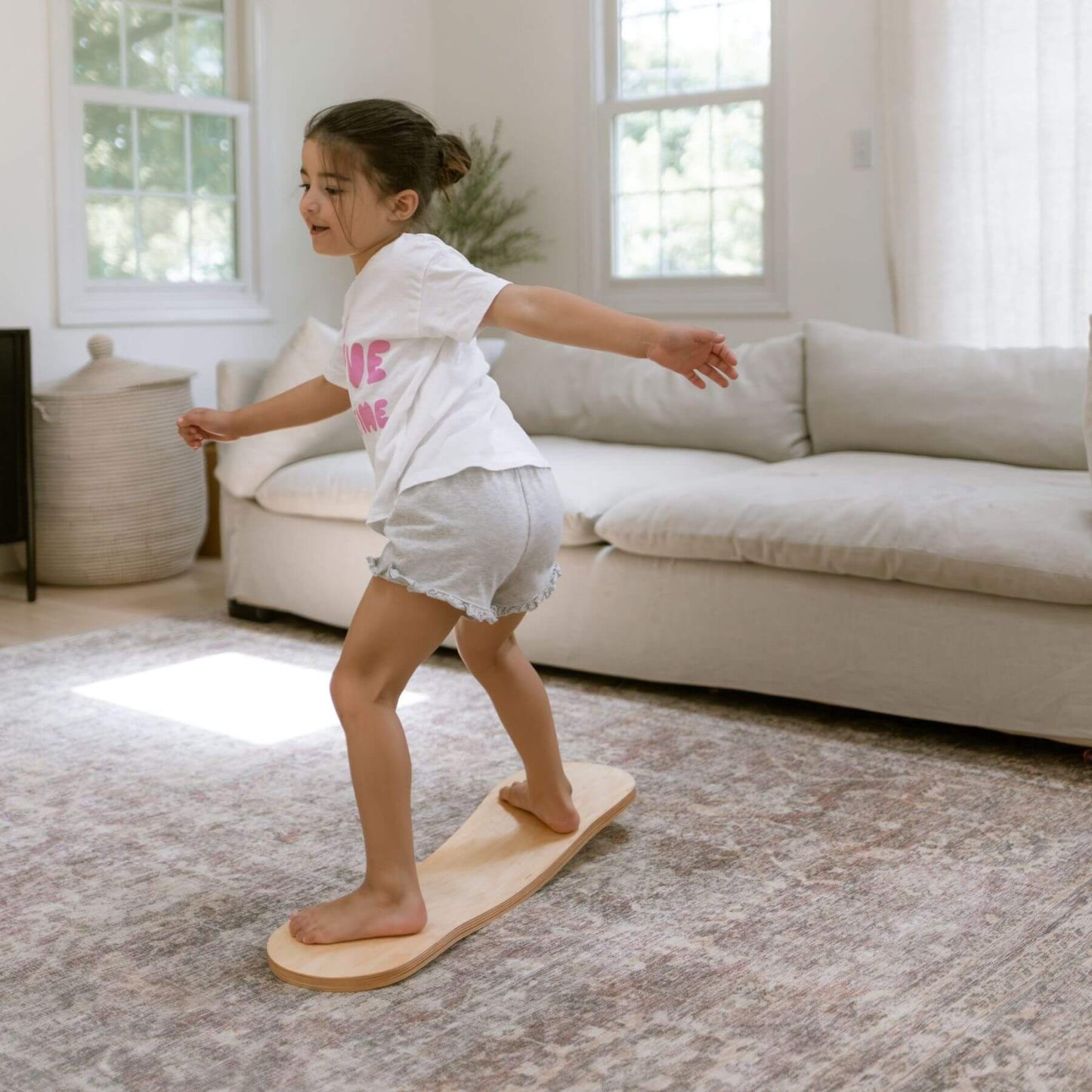 Kid playing with Spinzee Board in a living room