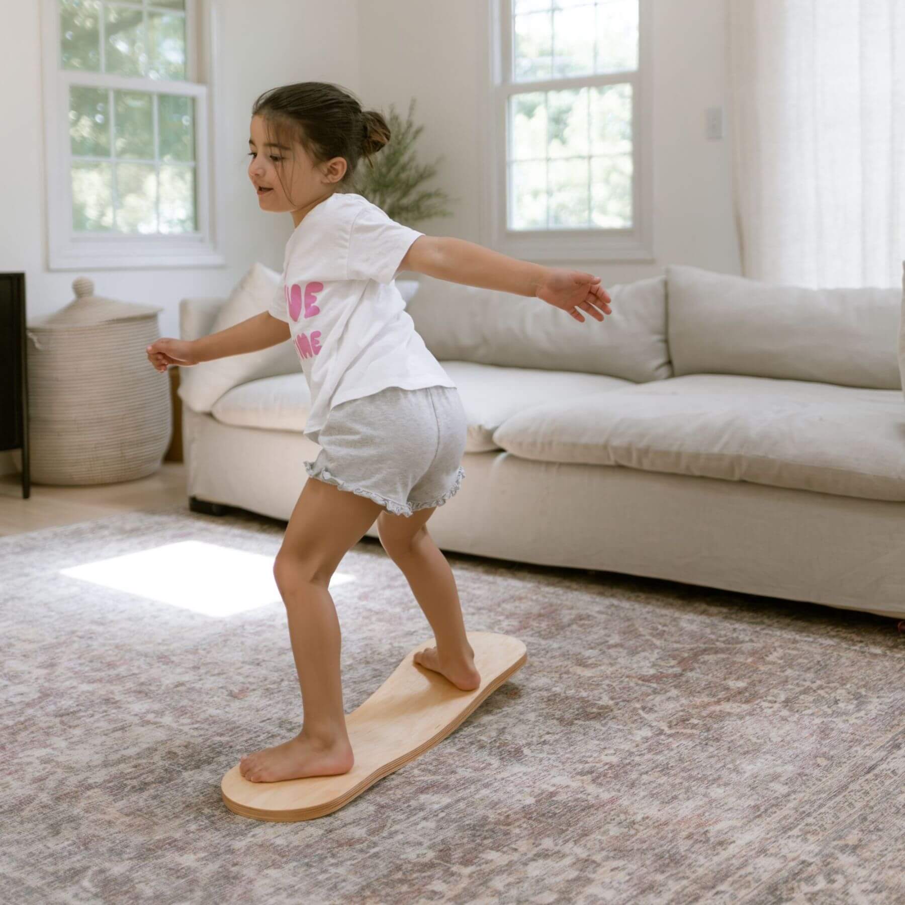 Kid playing with Spinzee Board in a living room