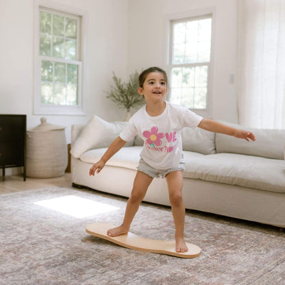 Kid playing with Spinzee Board in a living room