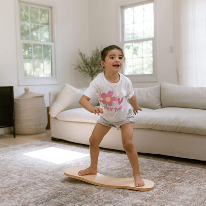 Kid playing with Spinzee Board in a living room