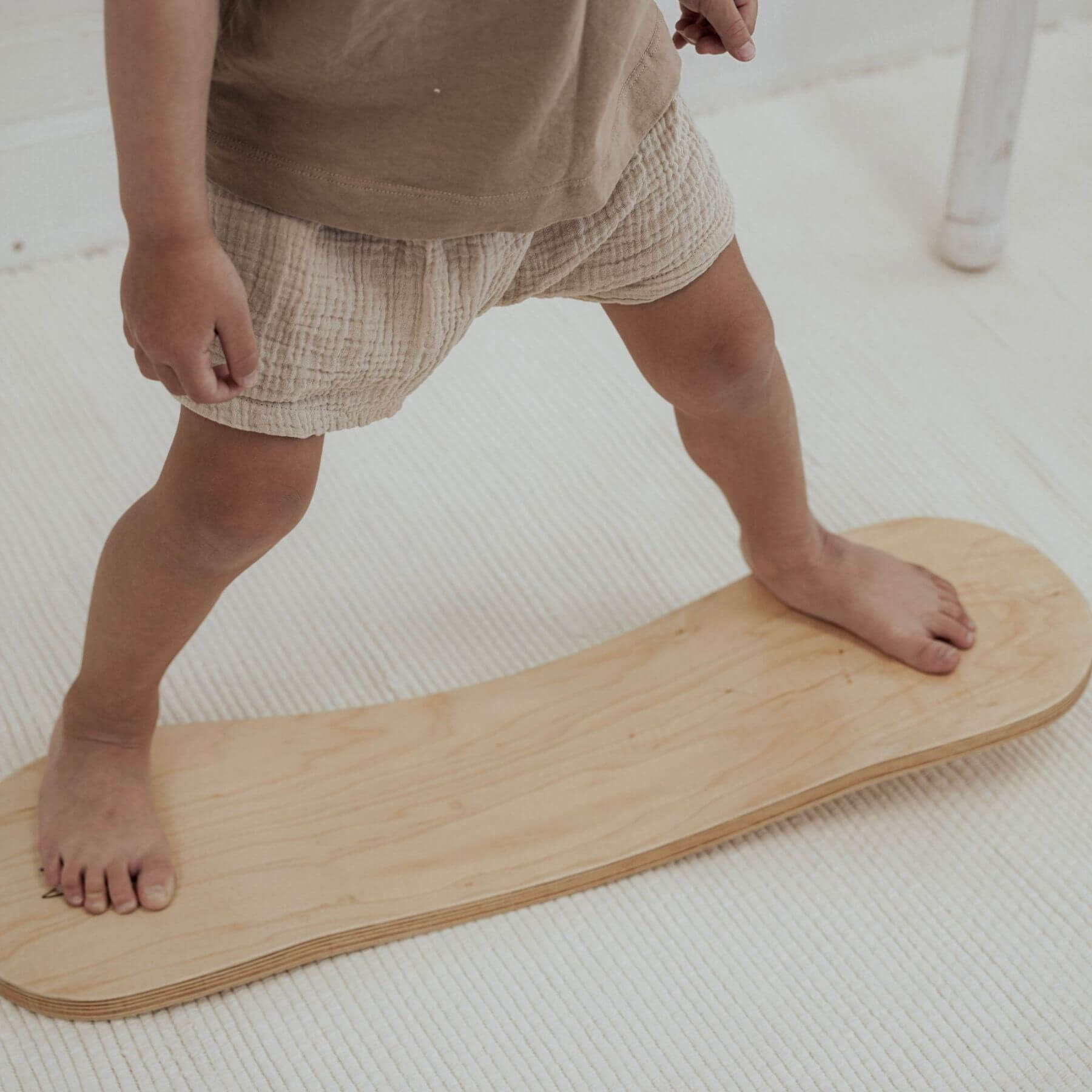 Kid playing with Spinzee Board in a room