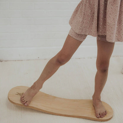 Kid playing with Spinzee Board in a room