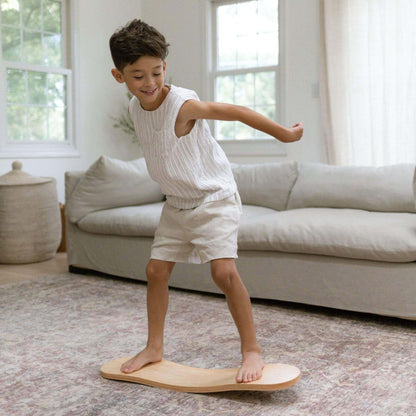 Kid playing with Spinzee Board in a living room