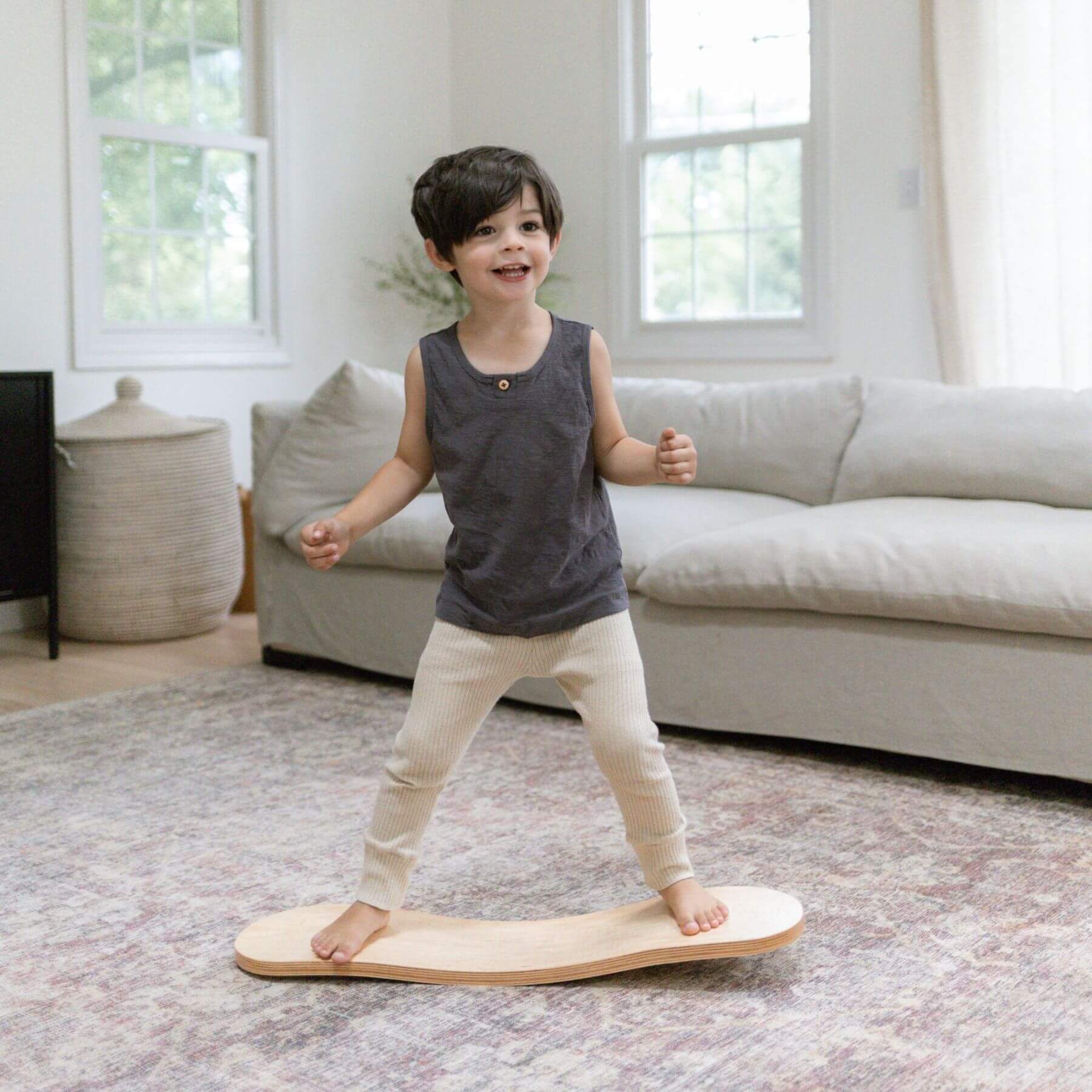 Kid playing with Spinzee Board in a living room