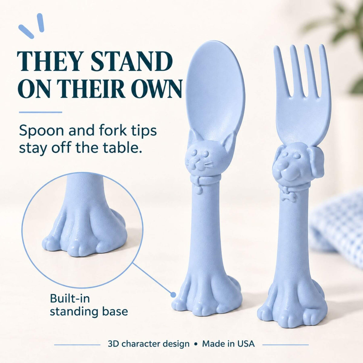 Spoon la la Toddler Utensils — 2-Pack - Blue, shown on a light neutral background with promotional text explaining that the utensils stand on their own.