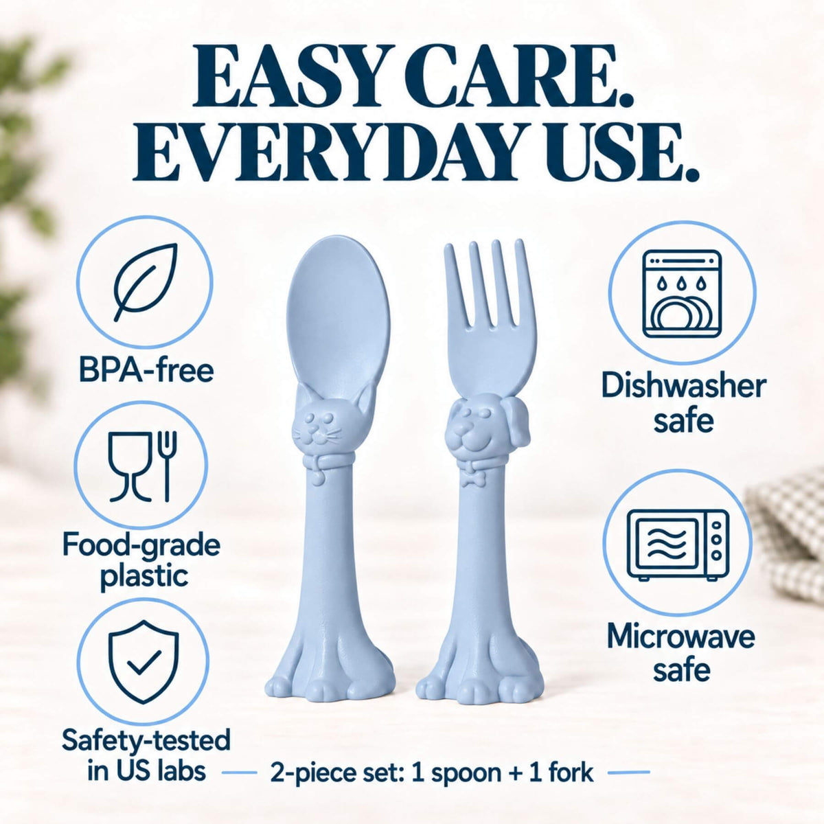 Spoon la la Toddler Utensils — 2-Pack - Blue, shown on a soft beige background with promotional text and icons for BPA-free, dishwasher safe, food-grade plastic, and microwave safe.