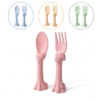 Spoon la la Toddler Utensils — 2-Pack - Pink, displayed on a white background with three circular insets showing other available colors (blue, yellow, and green).