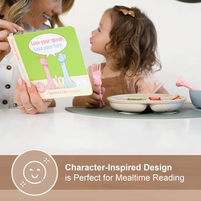 Woman and child at a table with a book titled 'Love your spoon, love your fork' and a pink fork.