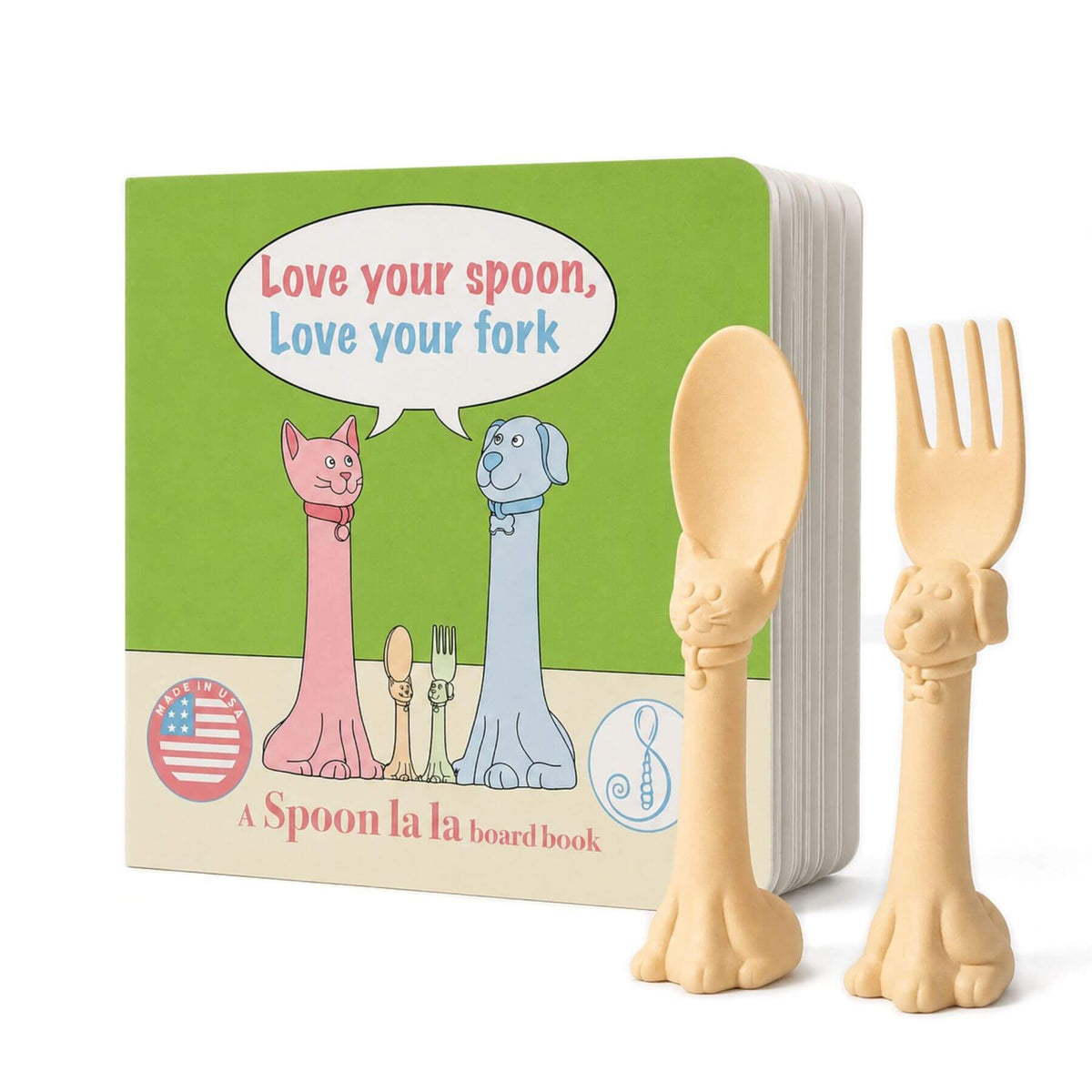 A Spoon la la board book set with a green board book and two beige animal-shaped utensils shaped like a cat spoon and a dog fork, shown on a white background.