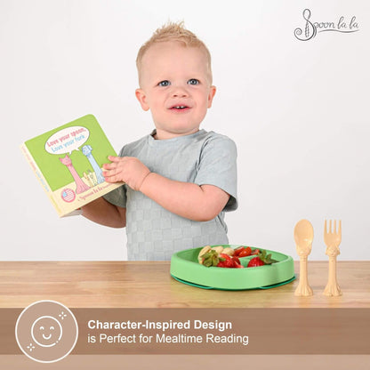 Child holding a book with a plate of food and utensils on a table, featuring Spoonla branding.
