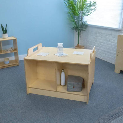 Stack-Able™ Table with shelves in a room with a blue wall and plants.