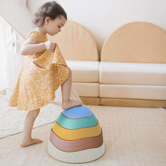 Child playing with Tiny Land® Stepping Stones - Beach Vacation in a bright room