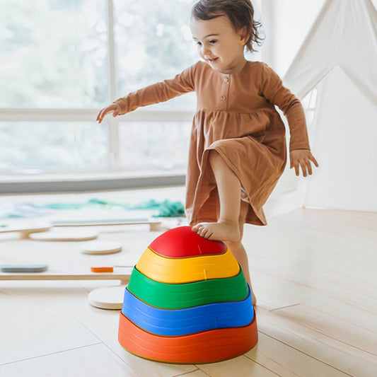 Girl Stepping on Tiny Land® Stepping Stones - Rainbow Color