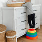 Boy Stepping on Tiny Land® Stepping Stones - Rainbow Color