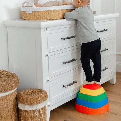 Boy Stepping on Tiny Land® Stepping Stones - Rainbow Color