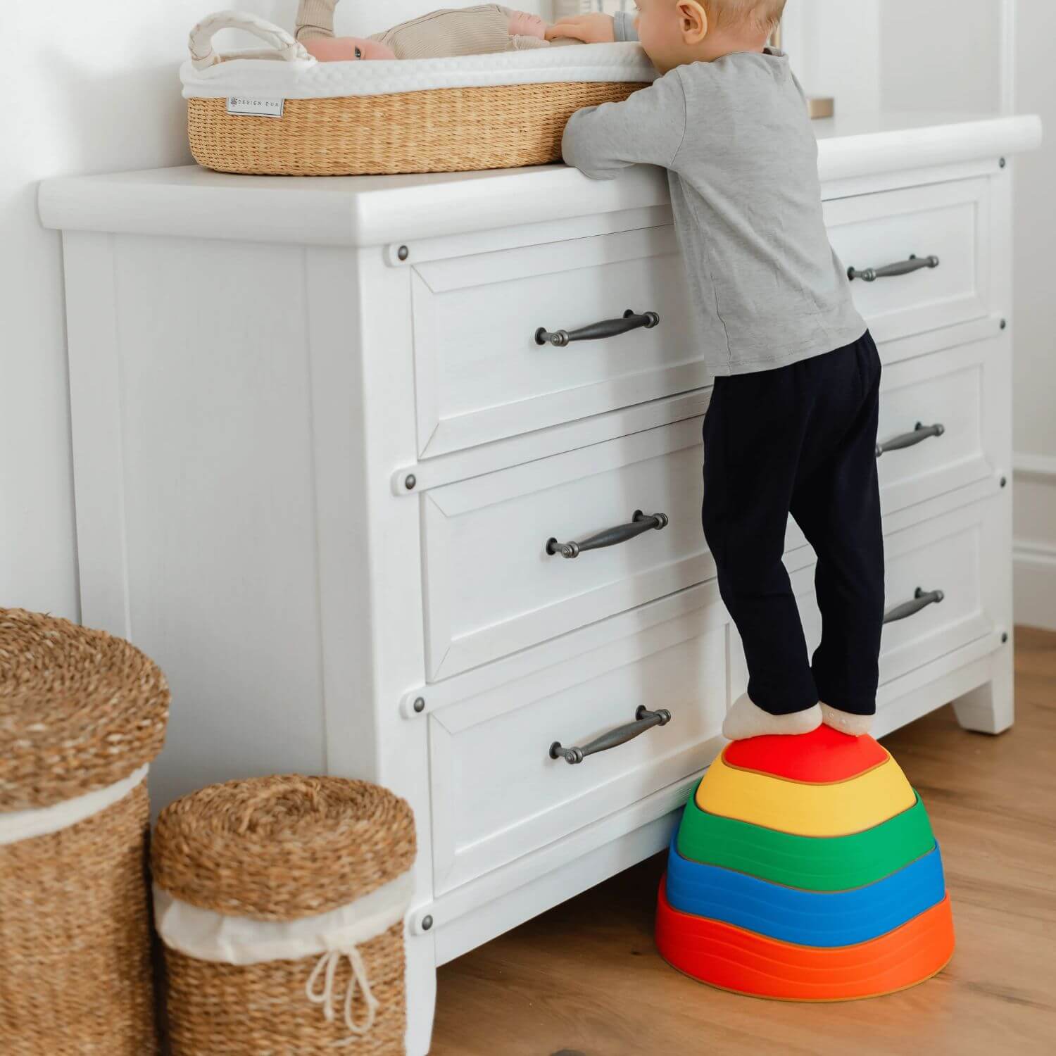 Boy Stepping on Tiny Land® Stepping Stones - Rainbow Color