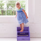 Girl Standing on Little Partners StepUp Step Stool Lilac