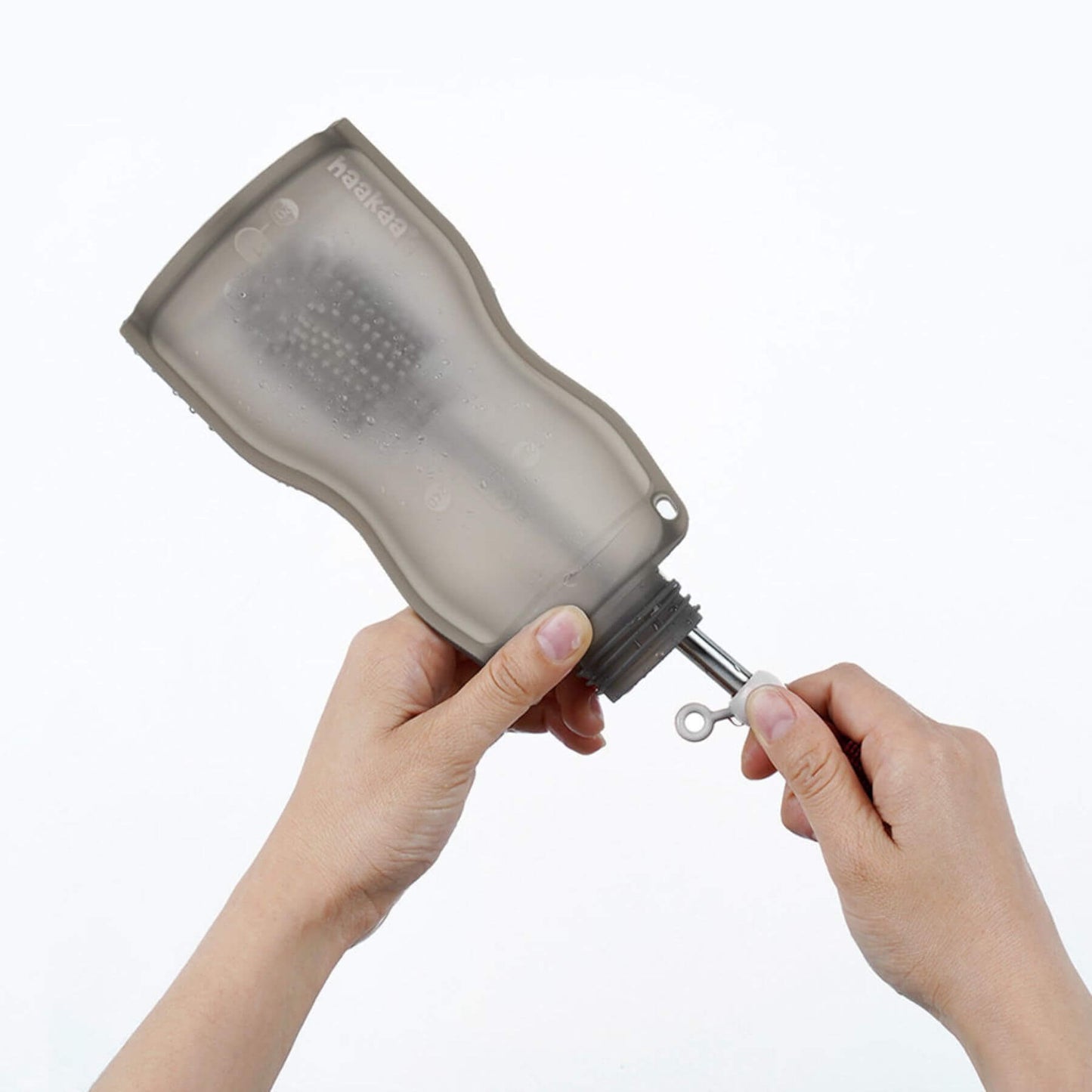 Person cleaning Haakaa Milk Storage Bag
