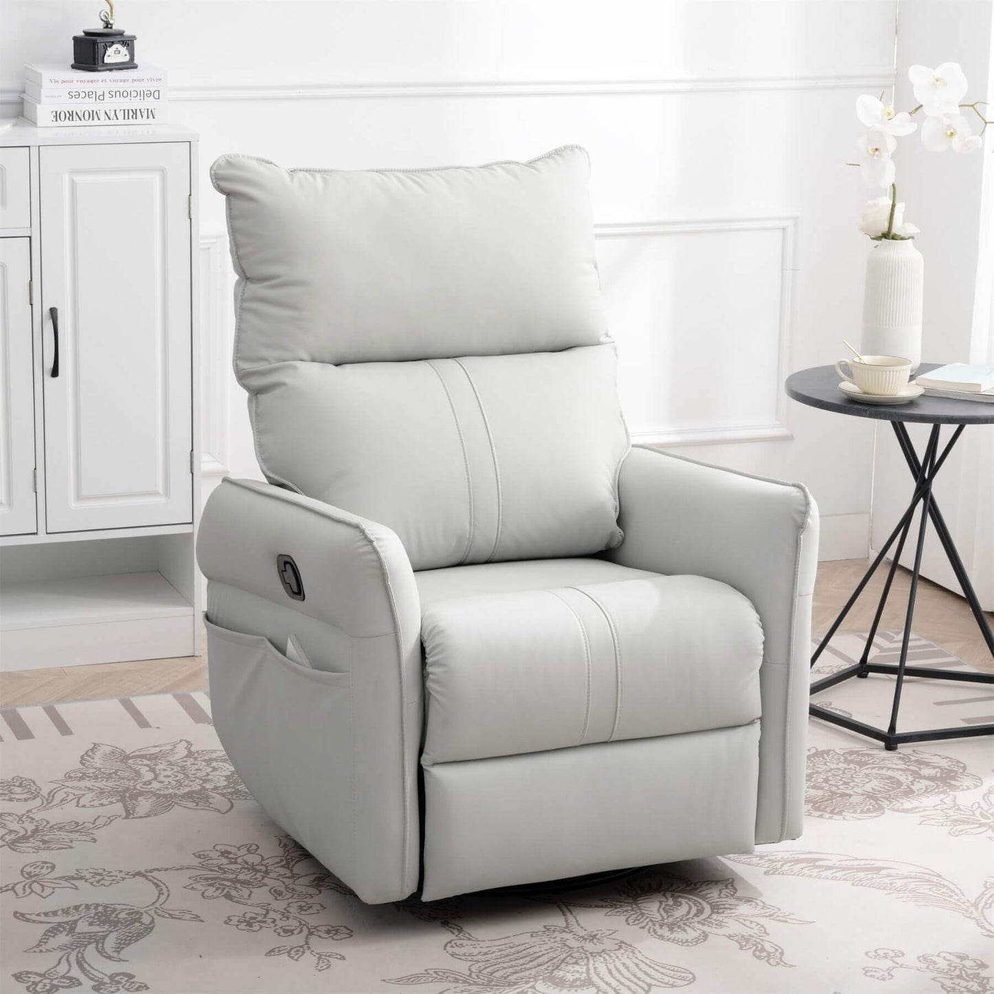 Sunco PU Modern Small Rocking Swivel Recliner Chair, Light Gray in a room with a side table and decor items.
