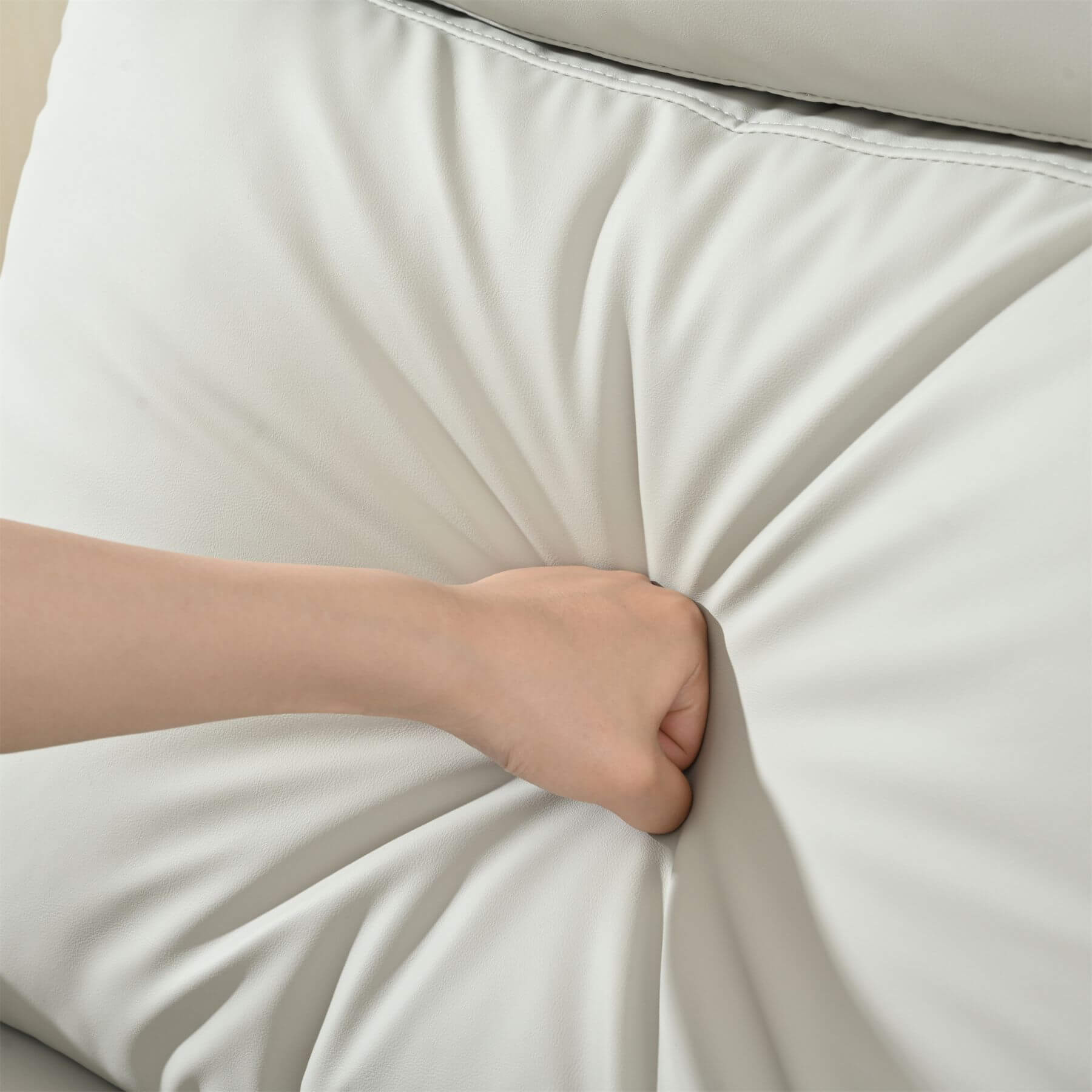 Hand pulling on Sunco Swivel Rocker Recliner Chair - Light Gray