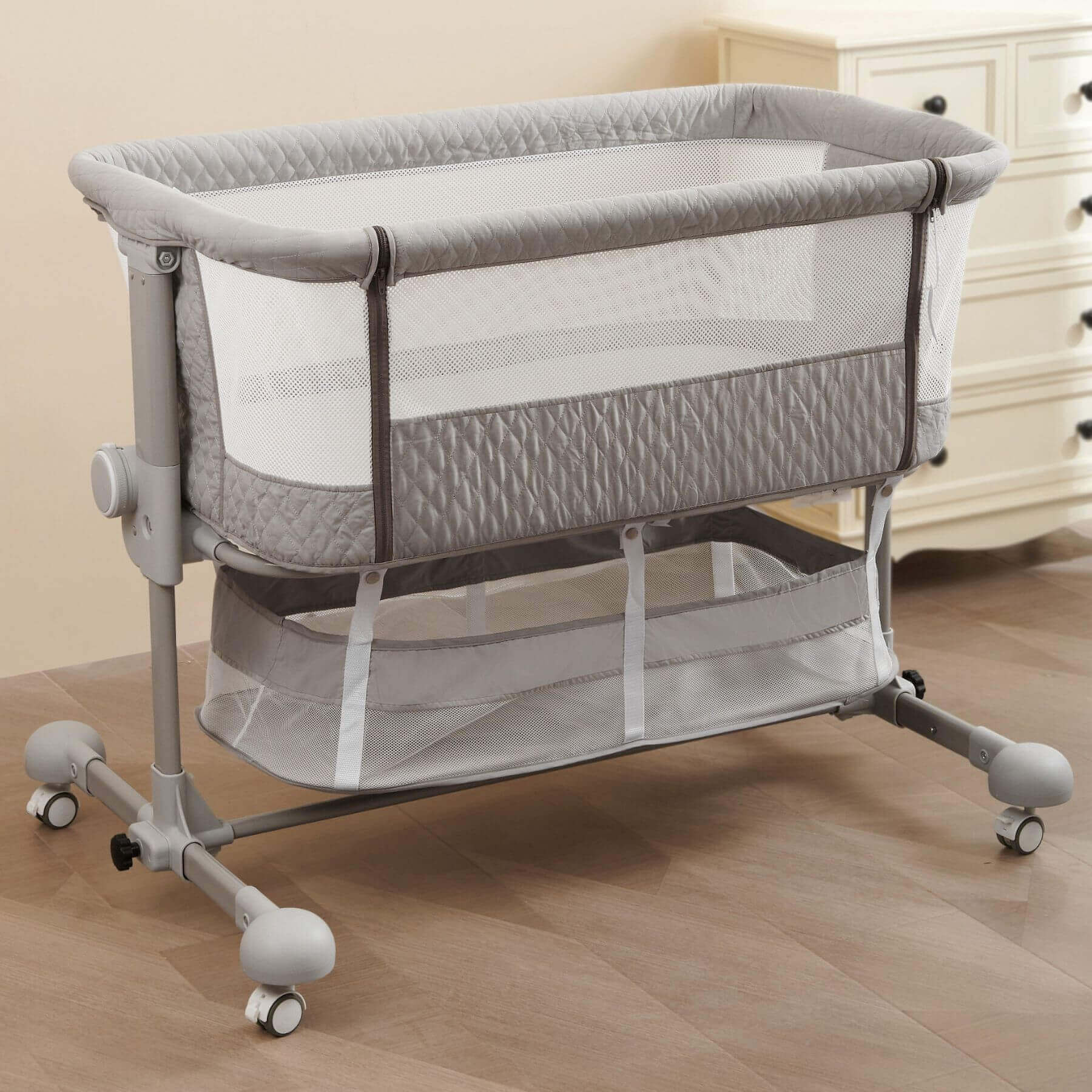 Sunveno Baby Bassinet Bedside Crib on a wooden floor