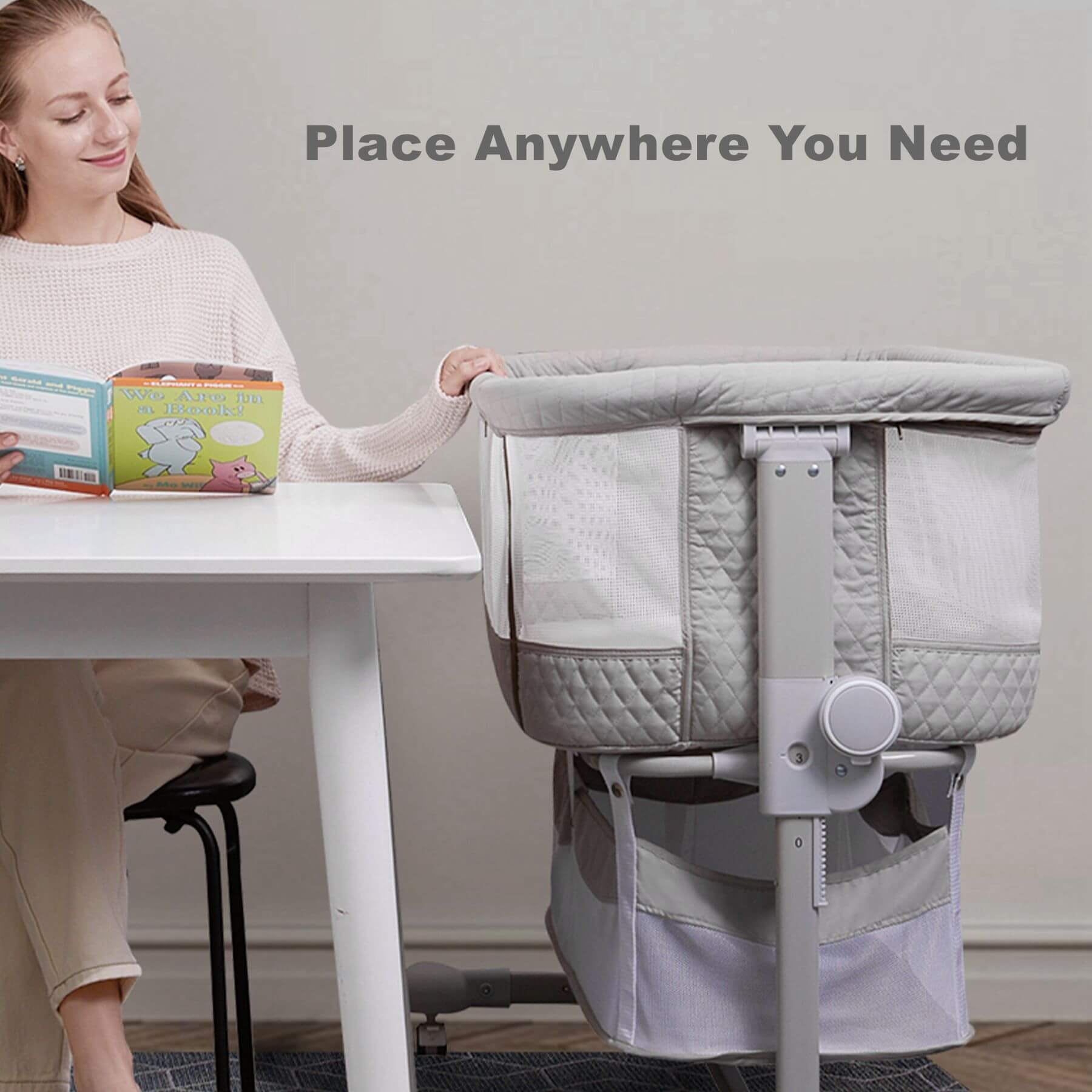 Woman with Sunveno Baby Bassinet Bedside Crib next to a table, with text 'Place Anywhere You Need'.