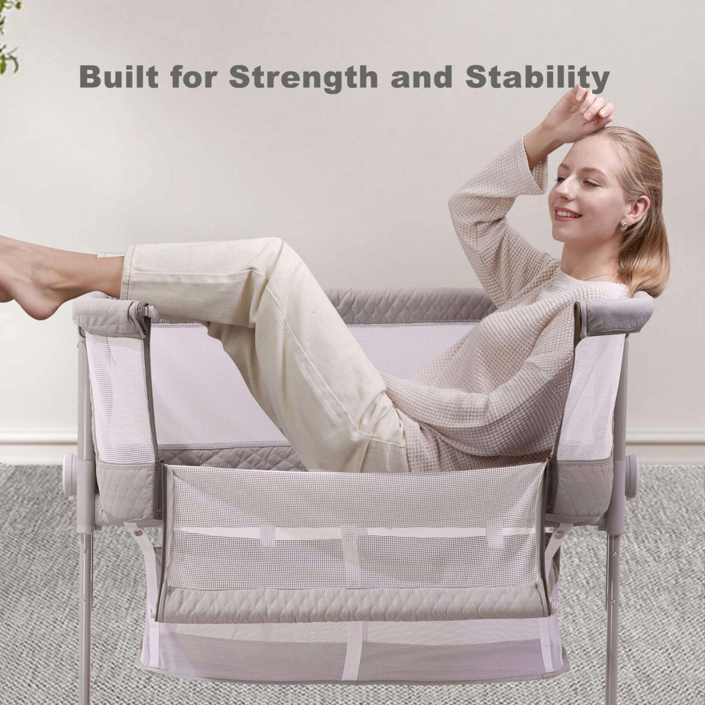 Woman relaxing in Sunveno Baby Bassinet Bedside Crib with text 'Built for Strength and Stability' above.